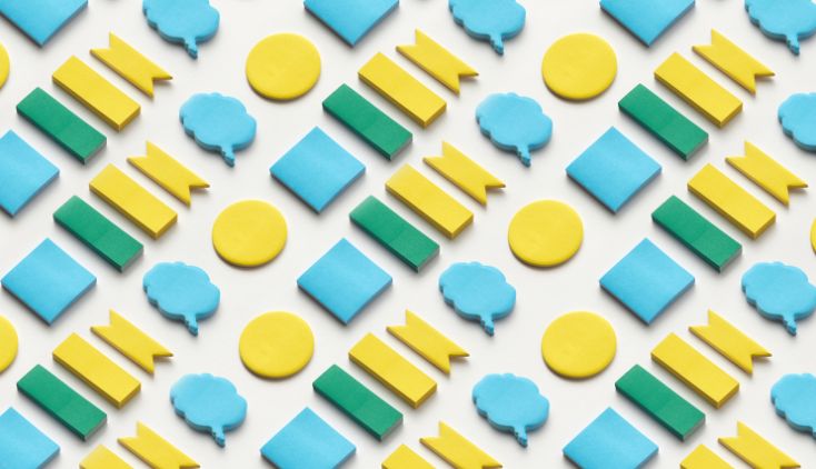 Green, yellow and blue speech bubbles on a white background.