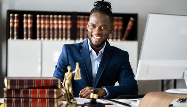 A lawyer sitting at a desk in his office.