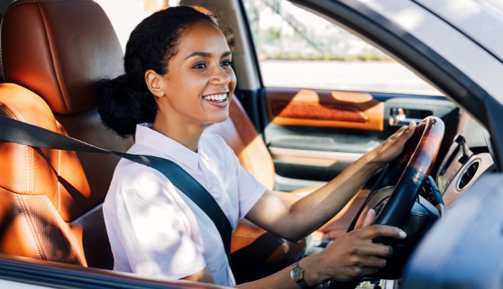 A woman driving a car.